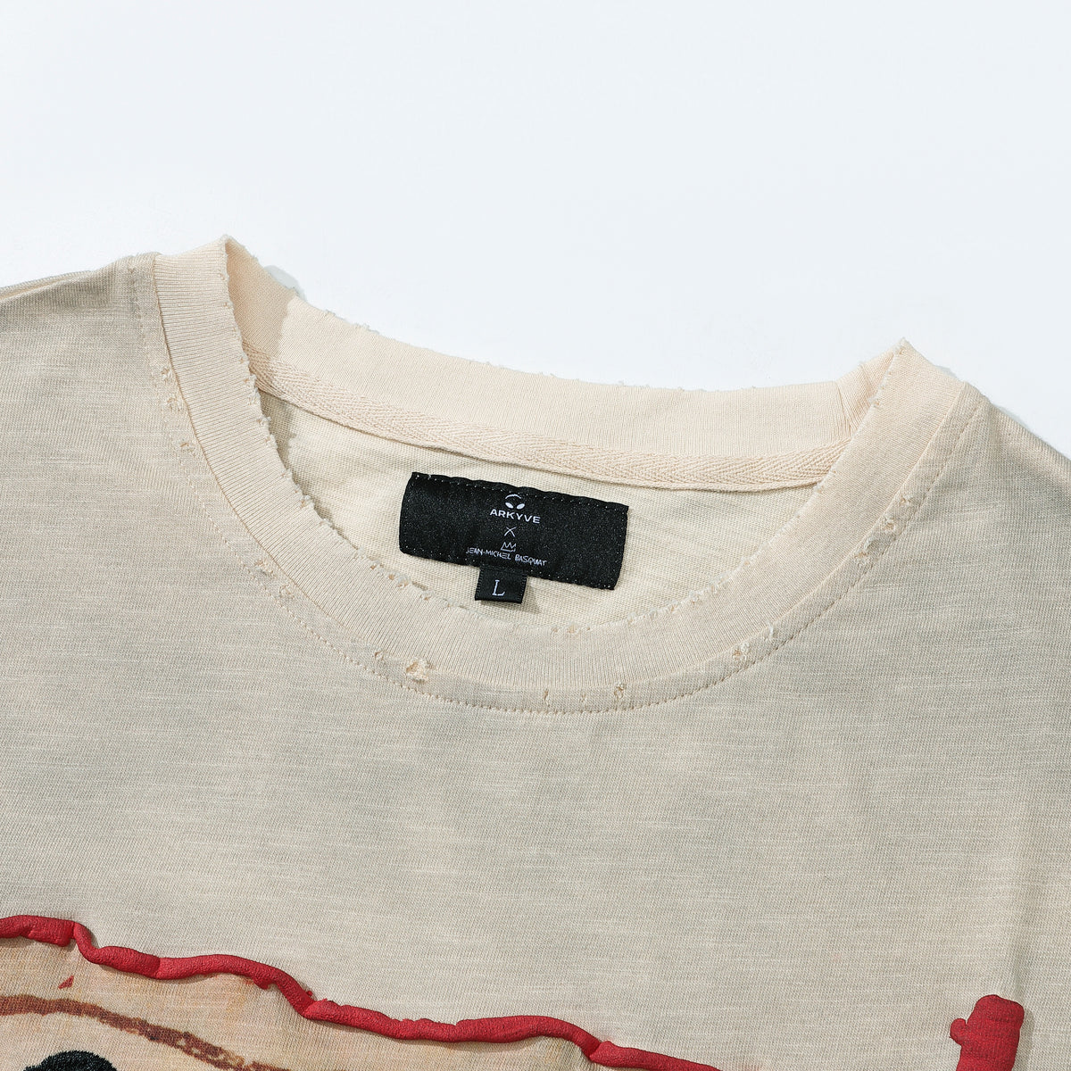 Arkyve X Basquiat 100 Yen Tee in cream, Arkyve x Jean-Michel Basquiat neck label