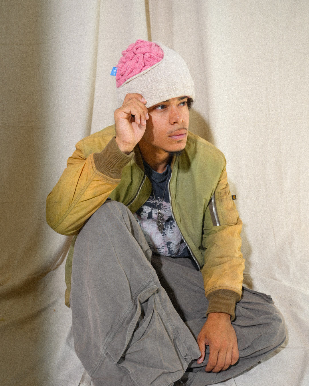 Brainie cream beanie with exposed pink crochet brain by Arkyve